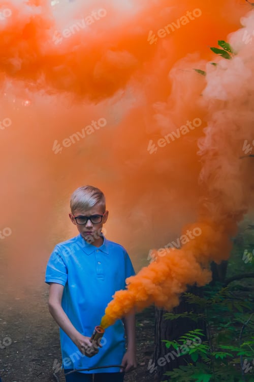 Preview: Boy hold orange smoke fire