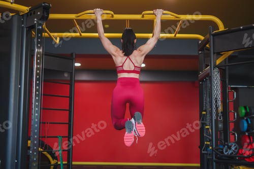 Preview: Anonymous sportswoman doing chin-ups
