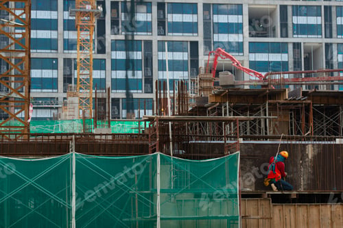 Preview: Construction workers fabricating steel reinforcement bar at the construction site
