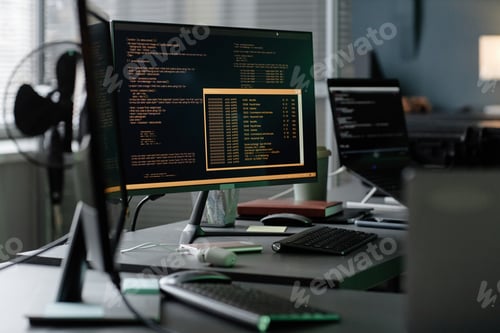 Preview: Screen Displaying Lines of Code of Computer on Programmers Workstation in Office