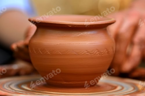 Preview: Potter making ceramic pot on the pottery wheel