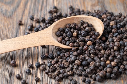 Preview: black pepper on wooden spoon
