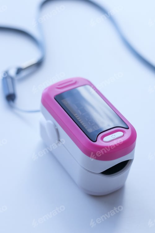 Preview: Pink pulse oximeter on white background