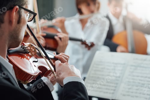 Preview: Violinist performing with classical orchestra