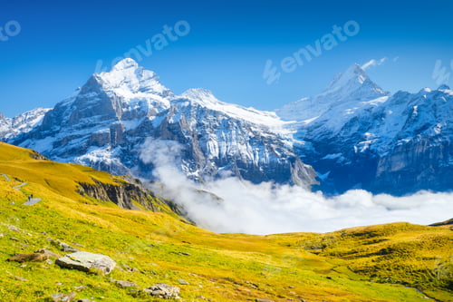 Preview: Nature. Mountains and clouds in the valley. Natural landscape high in the mountains.