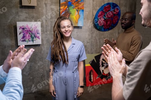 Preview: Young artist presenting the paintings in gallery