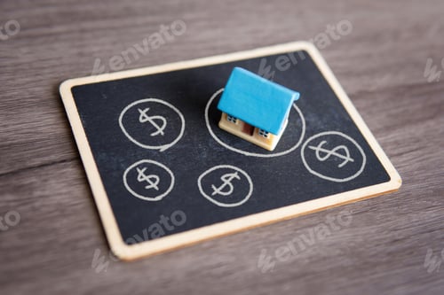 Preview: Closeup image of toy house and chalkboard.