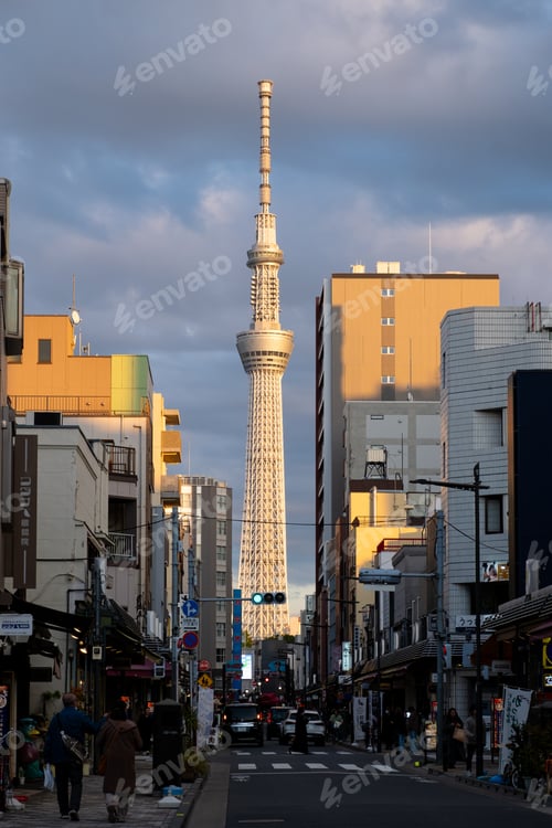 Preview: Tokyo Skytree towering above urban street at sunset