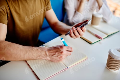 Preview: Cropped colleagues learning togetherness using smartphone for browsing web