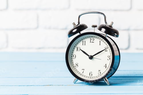 Preview: Black vintage alarm clock on wooden table