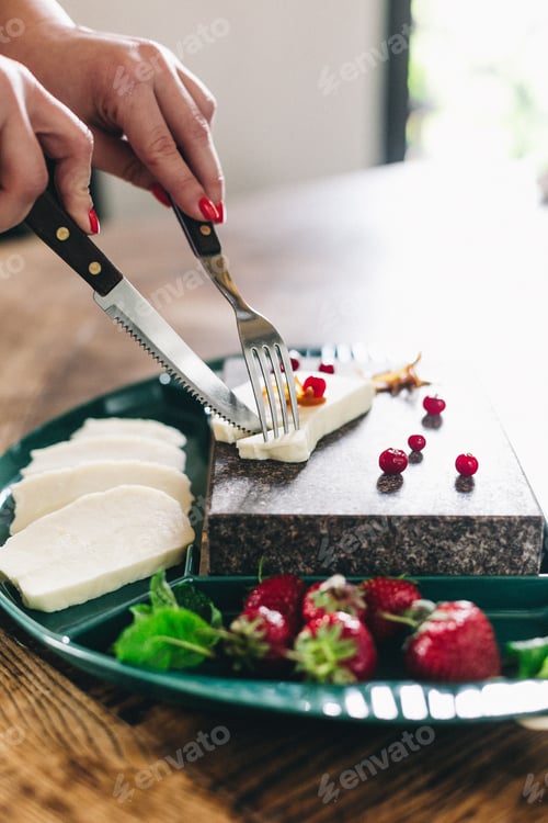 Vorschau: Mozzarella cheese in wooden bowl on white rustic table top view. Soft italian cheese