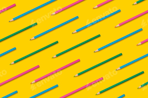 Preview: Pattern composition of colored pencils on a yellow background. Back to school concept.