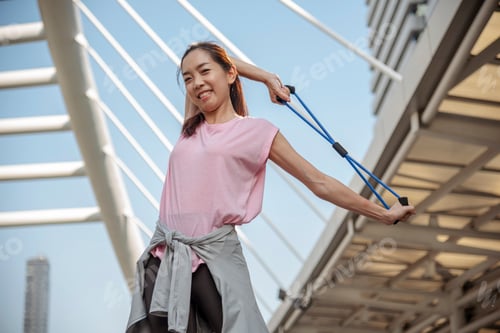 Preview: Sport Fitness Woman stretching body exercise in modern city wear wellness sportswear outside