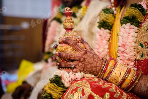 Preview: Bengali bride holding Wedding symbol sindoor box in her hand on her wedding day.
