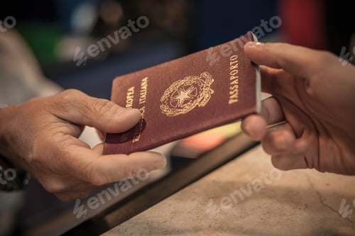 Preview: Person handing over passport, close up