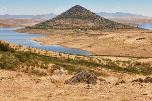 Preview: Picturesque hill pyramidal shape huge roundabout and road. Extremadura, Spain