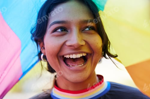 Preview: Rainbow, flag and lgbt with an indian woman in celebration of gay pride or human rights alone outdo