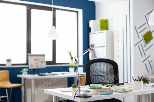 Preview: Lamp on a white desk in an empty modern business office