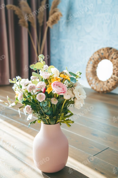 Preview: A textured pink vase filled with assorted flowers standing out against elegant pink curtains