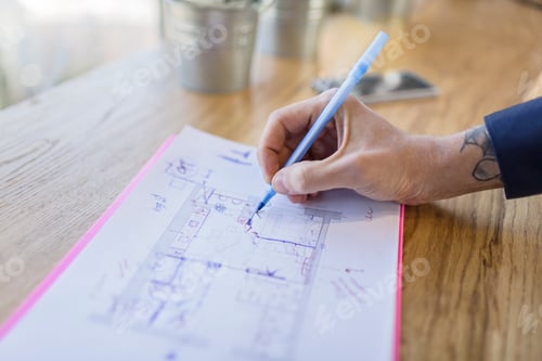 Preview: Close-up of architect working on construction plan