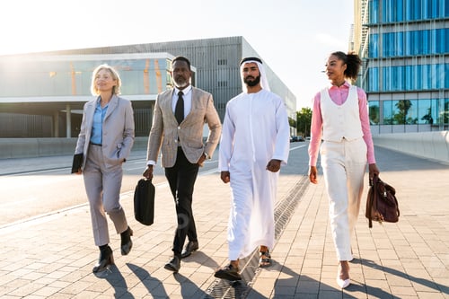 Preview: Group of multiethnic business people meeting an emirati businessman