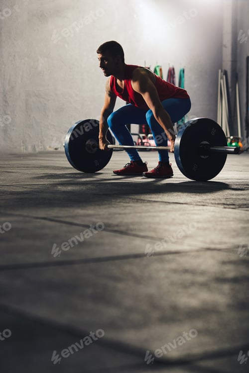 Preview: Caucasian man lifting a barbell.