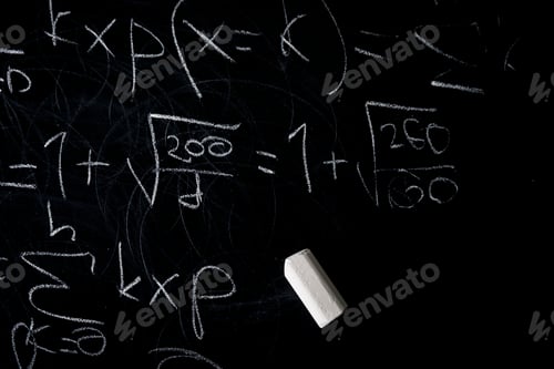 Preview: Part of maths formulas written by white chalk on the blackboard background.