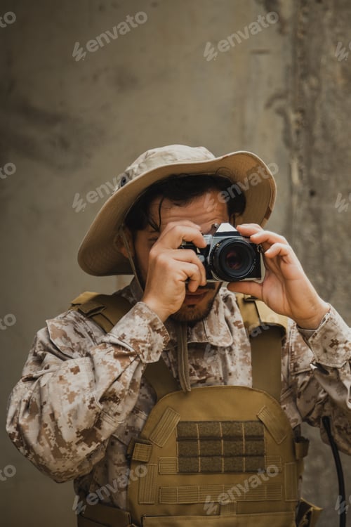 Preview: Soldier With A Camera Shooting Photos At The Enemies Tracks