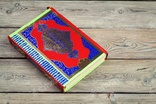 Preview: Koran holy book of Muslims, public item of all muslims on the table , still life