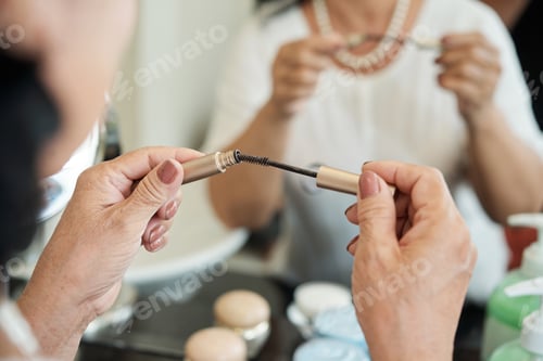 Preview: Elderly Woman Holding Mascara