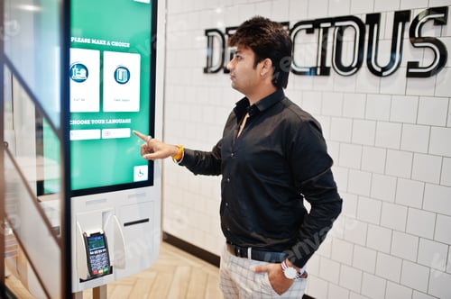 Preview: Indian man at fast food cafe