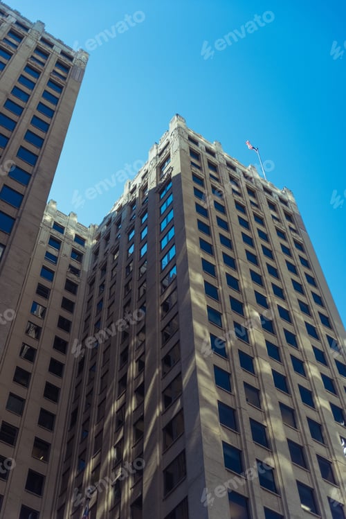 Preview: Tall Building In A Chicago Downtown With An American Flag On A Roof
