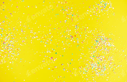 Preview: Colorful confetti on yellow table