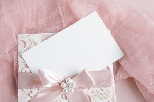 Preview: White wedding luxury invitation card mockup 7x5 on pastel pink background with envelop and fabric