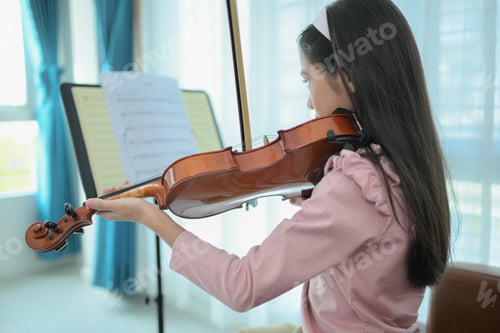 Preview: A girl violinist plays and practices the violin at home