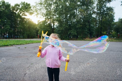 Preview: child doing big soap bubble