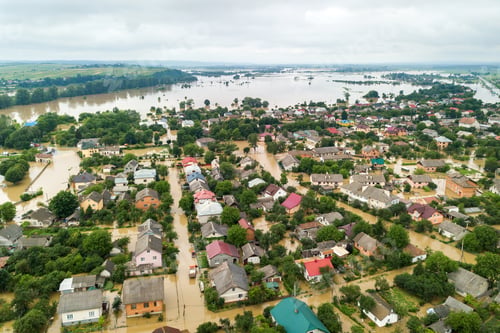 Preview: Aerial view of flooded houses with dirty water of Dnister river in Halych town, western Ukraine