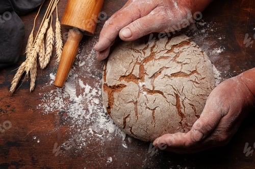 Preview: Baker holding fresh baked homemade bread