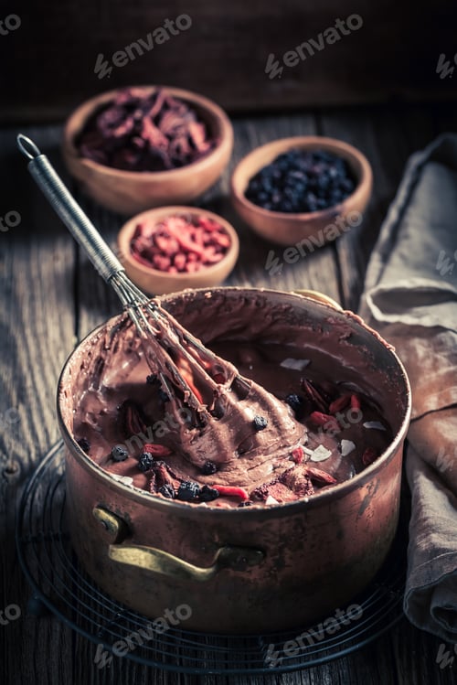 Preview: Closeup of sweet chocolate with dried fruits and berries