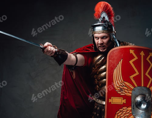 Preview: Angry roman soldier points sword against dark background