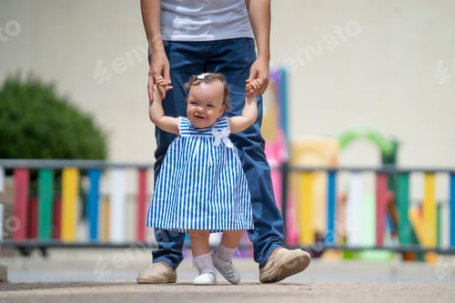 Preview: Little girl learning to walk