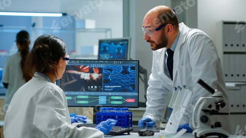 Preview: Team of scientists worried about virus evolution discussing in lab