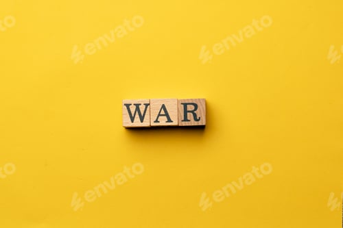 Preview: a yellow warm background without shadows wooden cubes with black letters laid out word war