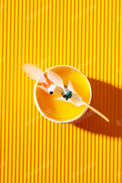 Preview: Miniature people and egg on textured yellow background
