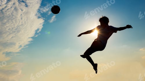 Preview: Silhouette action sport outdoors of football players on the sunset sky. Athlete man jumping kick soc