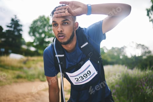 Preview: Runner man, race and tired in nature, thinking and rest for sweat, breathe or vision in woods for t