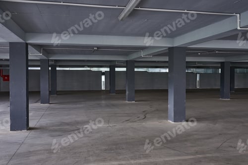 Preview: Empty underground parking lot or garage interior with concrete columns.