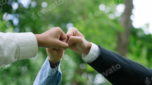 Preview: Business people join hands together for CSR, corporate social responsibility. World environment day.