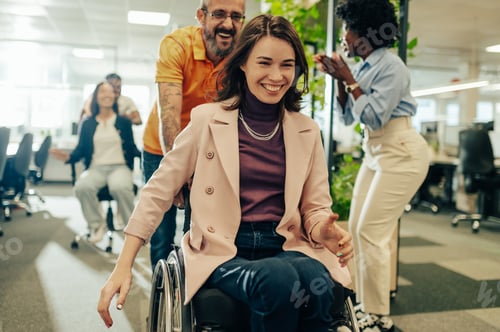 Preview: Woman who uses a wheelchair celebrating win in an office chair race