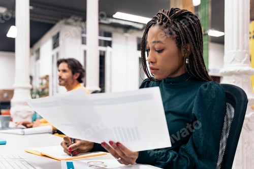 Preview: Focused African Woman Working in the Office